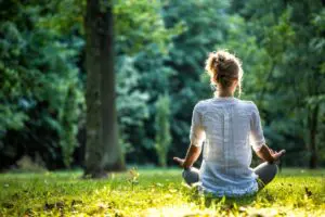 Woman meditating for self-care